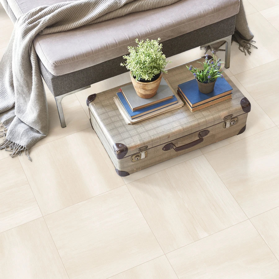 Serene Layers Desert Ivory 24×24 porcelain tile installed on a bedroom floor.