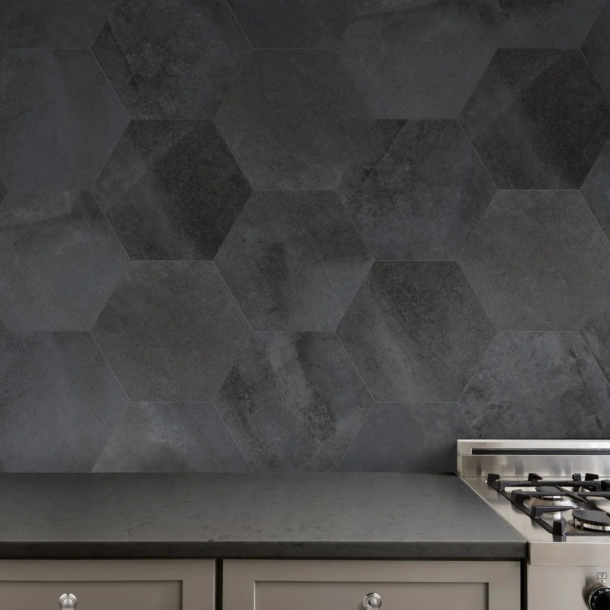 Textura Anthracite 14×16 porcelain hexagon tile installed on a feature wall.