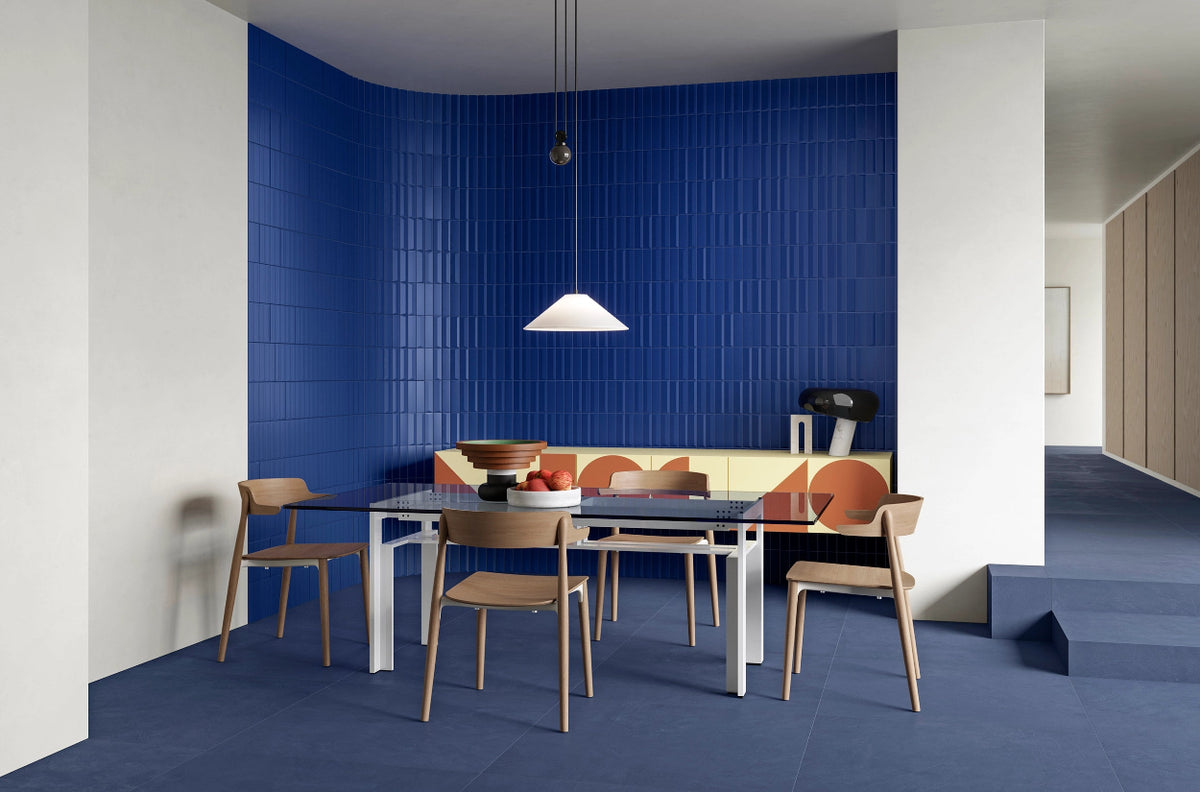 Rhythm Deep Azure ceramic wall tile installed on a café feature wall.