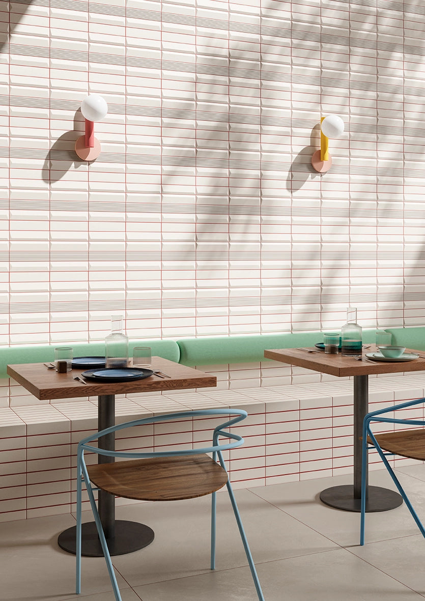 Rhythm Ivory satin ceramic wall tile installed on a restaurant wall.