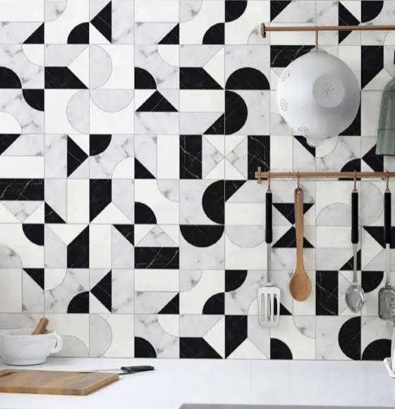 Modernist Expressions Abstract Noir marble mosaic installed as a kitchen backsplash.