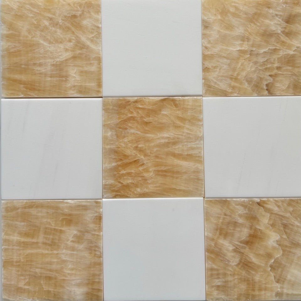 Checkerboard application pairing Bianco Dolomite marble with Honey Onyx tiles.