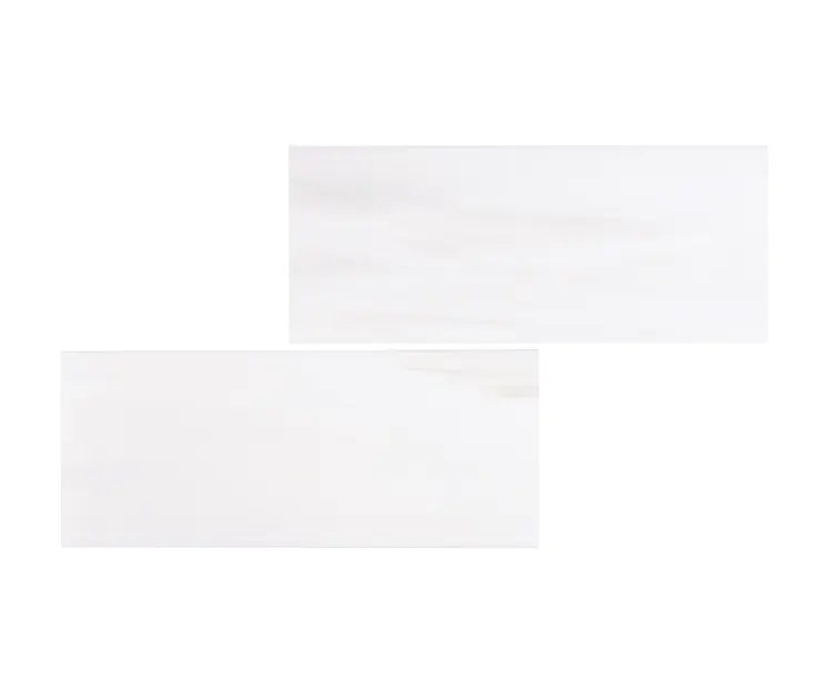 Bianco Dolomite marble 3×6 subway tiles comparing honed and polished finishes.