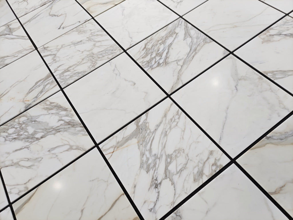 Calacatta Gold honed 24×24 inches marble tile.