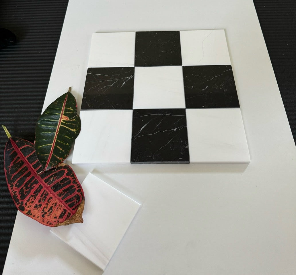 Bianco Dolomite & Nero Marquina multi-size polished or honed natural-stone checkerboard tile pattern.