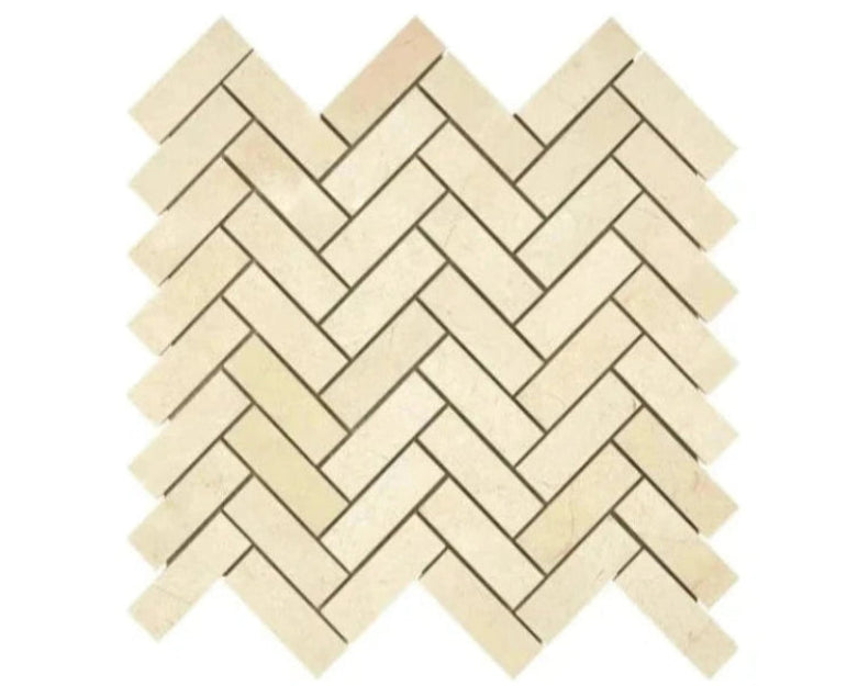 Crema Marfil 1×3 herringbone marble mosaic in polished or honed finish.