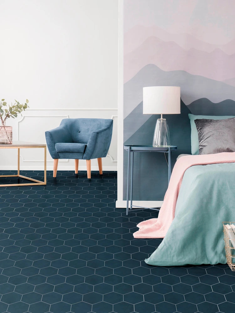 Fez Deep Azure solid porcelain hexagon tile installed on a bedroom floor.