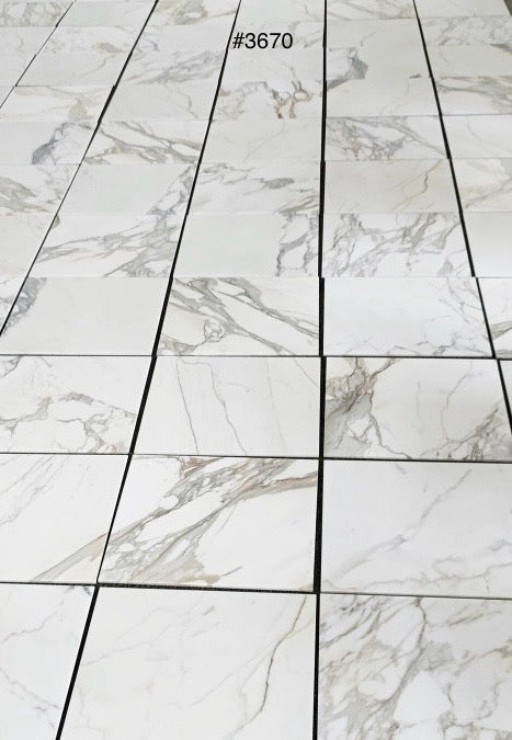 Calacatta Gold 24×24 inches marble tile dry-lay or inventory selection view.