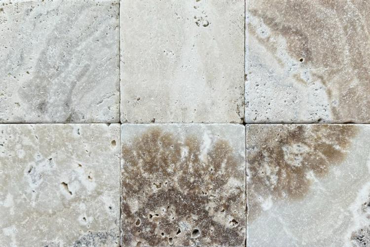 LaTravonya Travertine and Onyx collection material reference in warm earth tones.