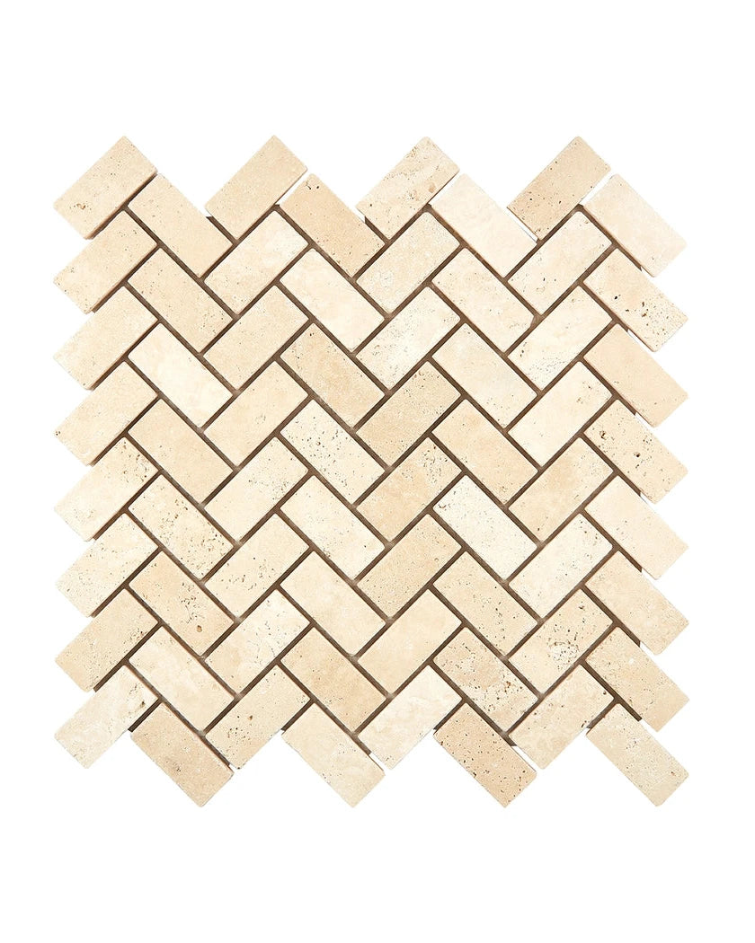1×2 Herringbone Mosaic showing tumbled warm ivory-beige Ivory Travertine.