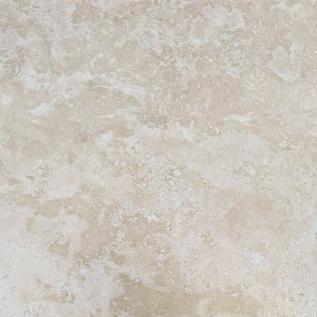 18×18 Field Tile showing honed and filled warm ivory-beige Ivory Travertine.
