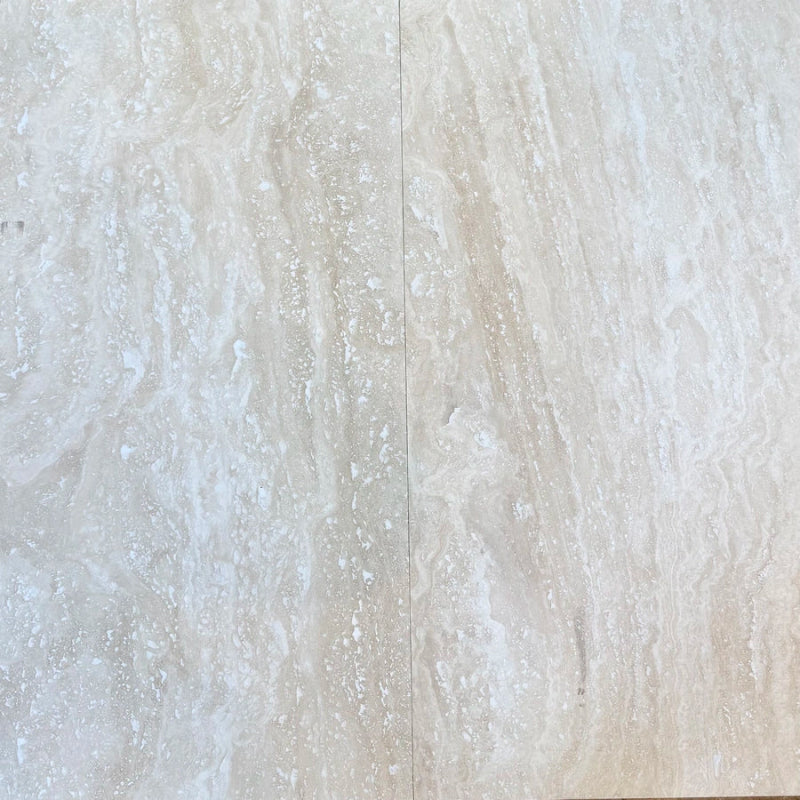 18×36 Large-Format Tile showing vein-cut and honed and filled warm ivory-beige Ivory Travertine.