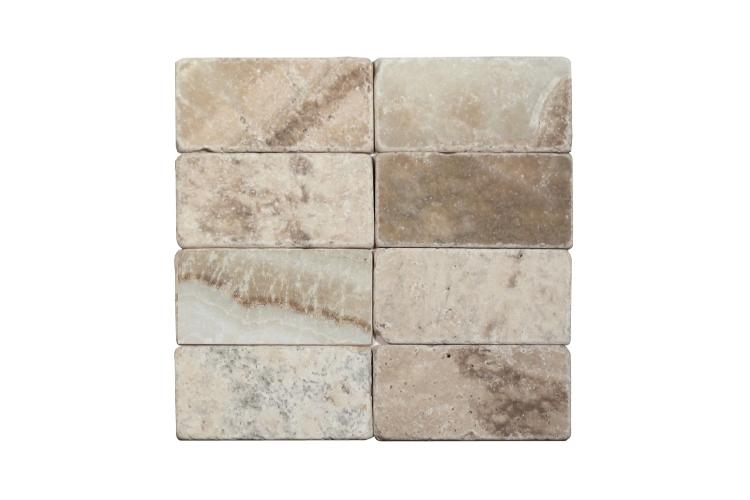 LaTravonya Travertine 3×6 tumbled subway tile.