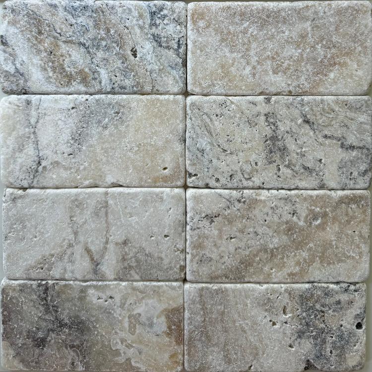 LaTravonya Travertine 3×6 tumbled subway tile pattern.
