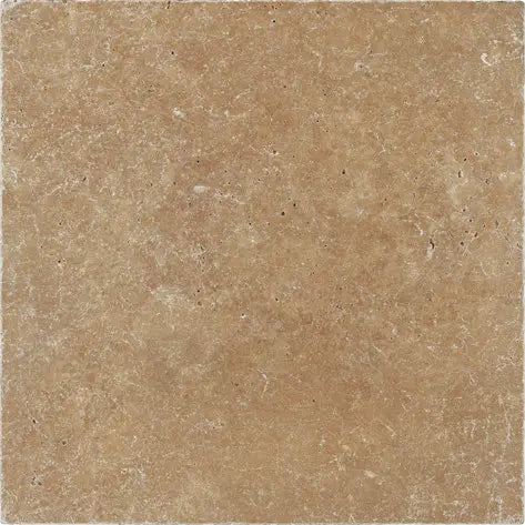 Noce Travertine 12×12 tumbled tile with softened edges and warm earthy brown variation.