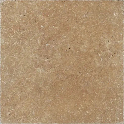 Noce Travertine 12×12 tumbled tile with softened edges and warm earthy brown variation.