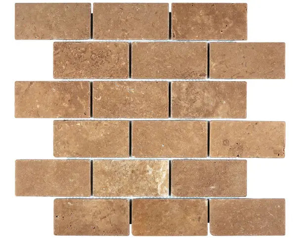 Noce Travertine 2×4 tumbled mosaic with softened edges and warm brown variation.