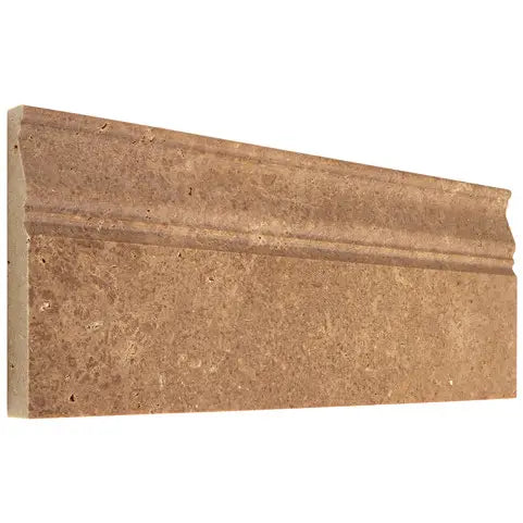 Noce Travertine 4¾×12 honed baseboard trim with a sculpted architectural profile.