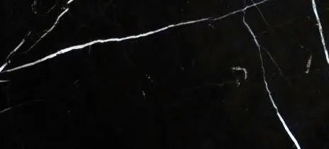 Nero Marquina marble 6×12 micro-beveled subway tile in a polished or honed finish.