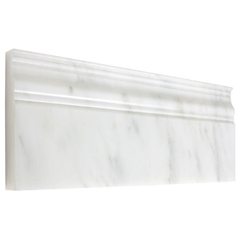 Oriental White marble 4¾×12 baseboard with a polished finish at a floor-to-wall transition.