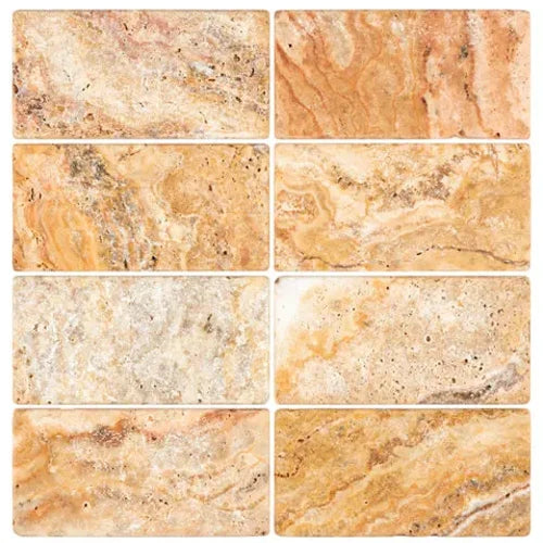 Scabos Travertine 3×6 tumbled tile with gold, rust, red, and brown variation.