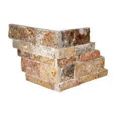 Scabos Travertine split-face corner unit for coordinating dimensional wall cladding.