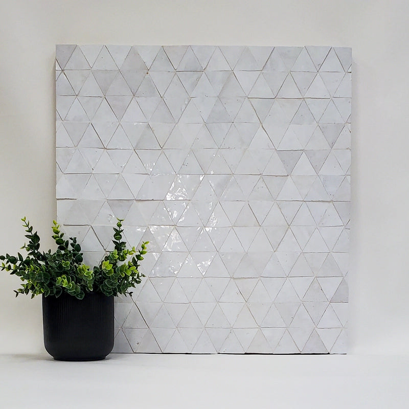 Handmade Moroccan Zellige Triangle mosaic showing glossy interlocking geometry.