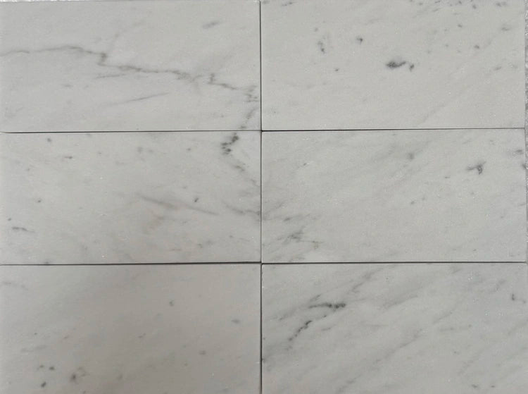 Carrara White Gioia marble 3×6 subway tile with a polished finish.