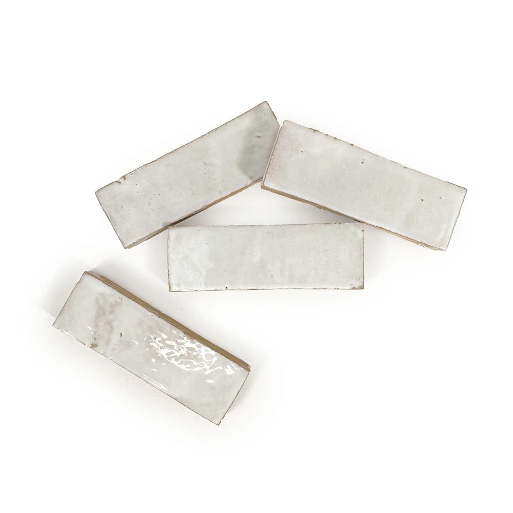 Casablanca White glossy handmade Moroccan Zellige 2×6 rectangular wall tile in a stacked layout.