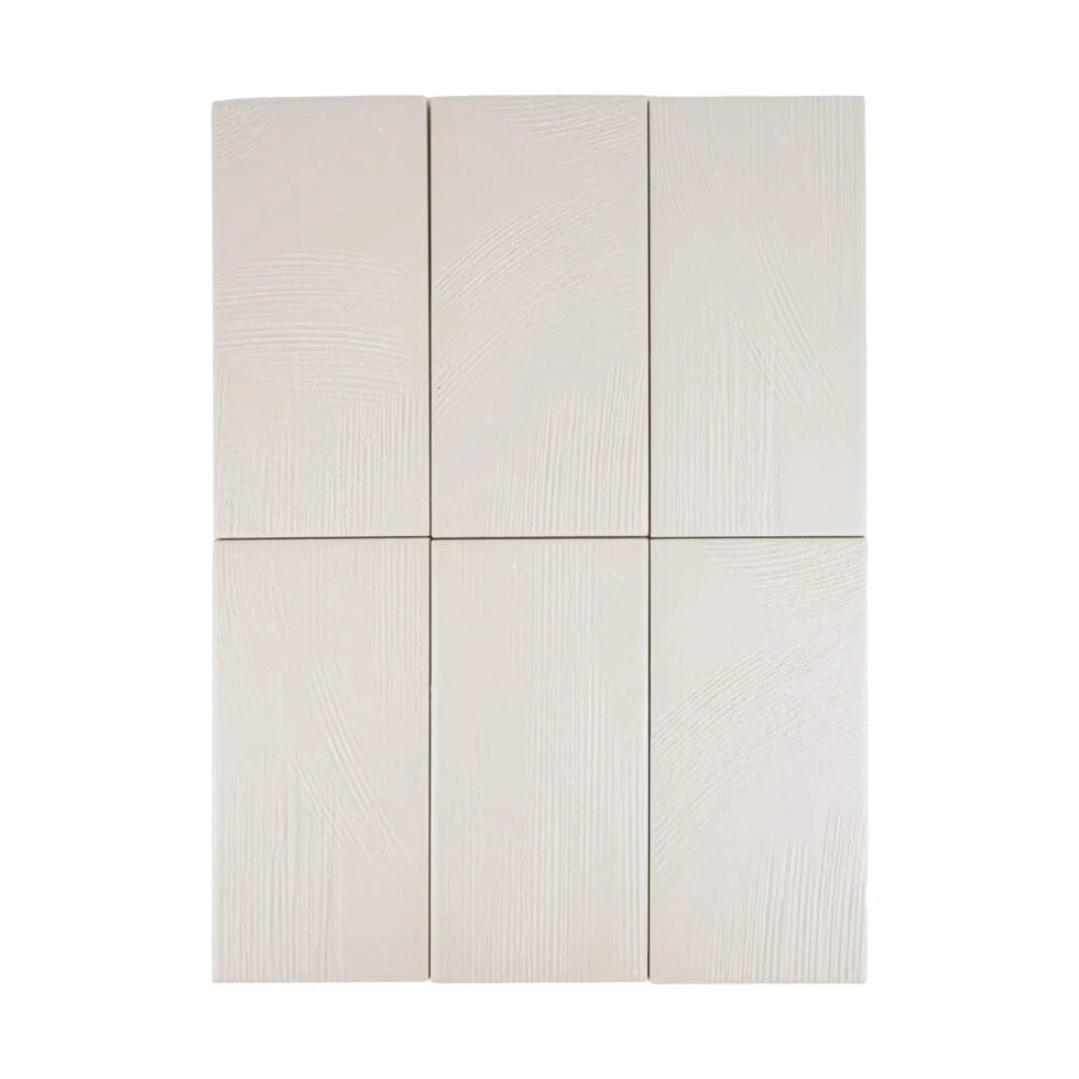 Stria Luna Plaster 3.5×7 porcelain tiles arranged to show color and texture variation.
