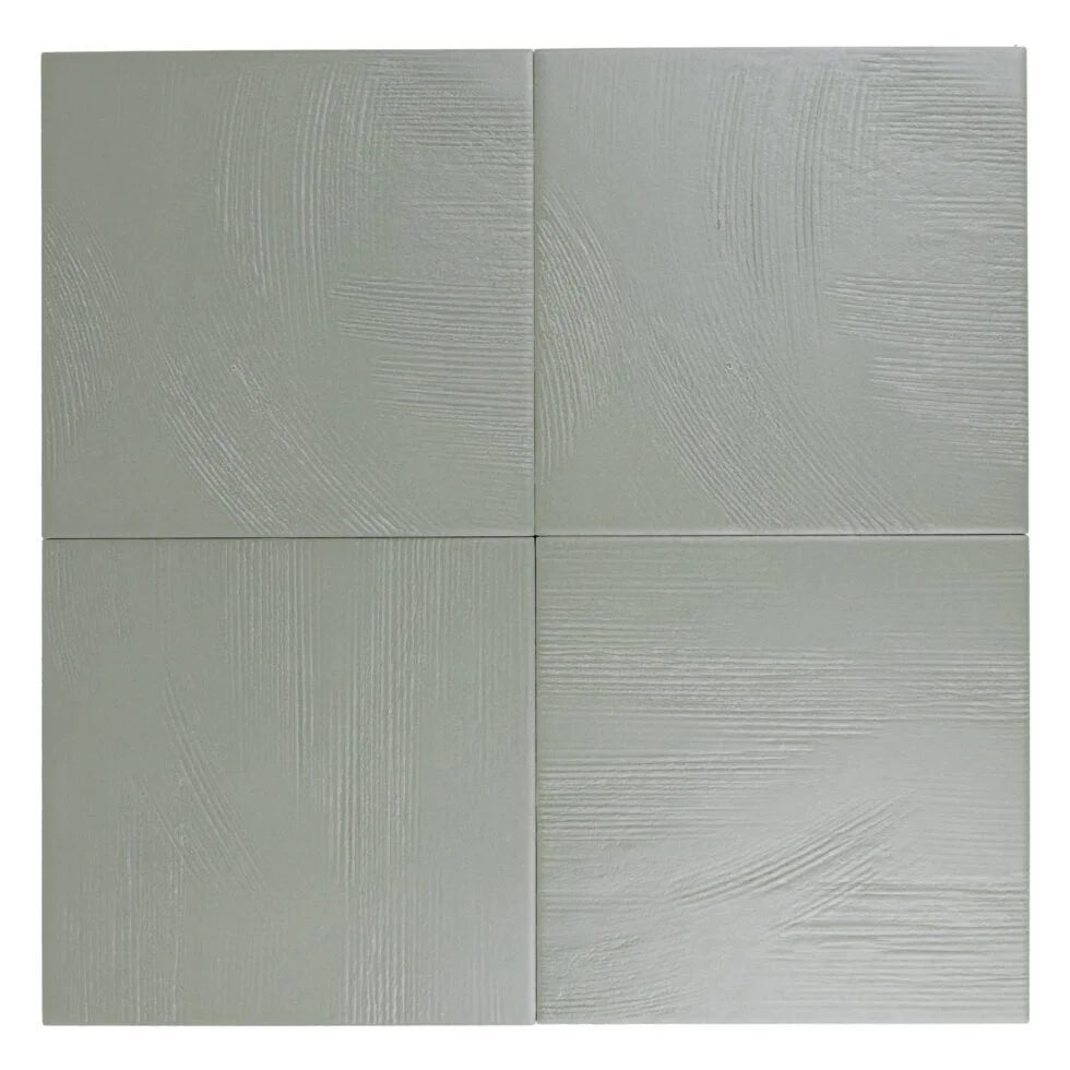 Stria Olive Sage 7×7 porcelain tiles arranged to show color and texture variation.