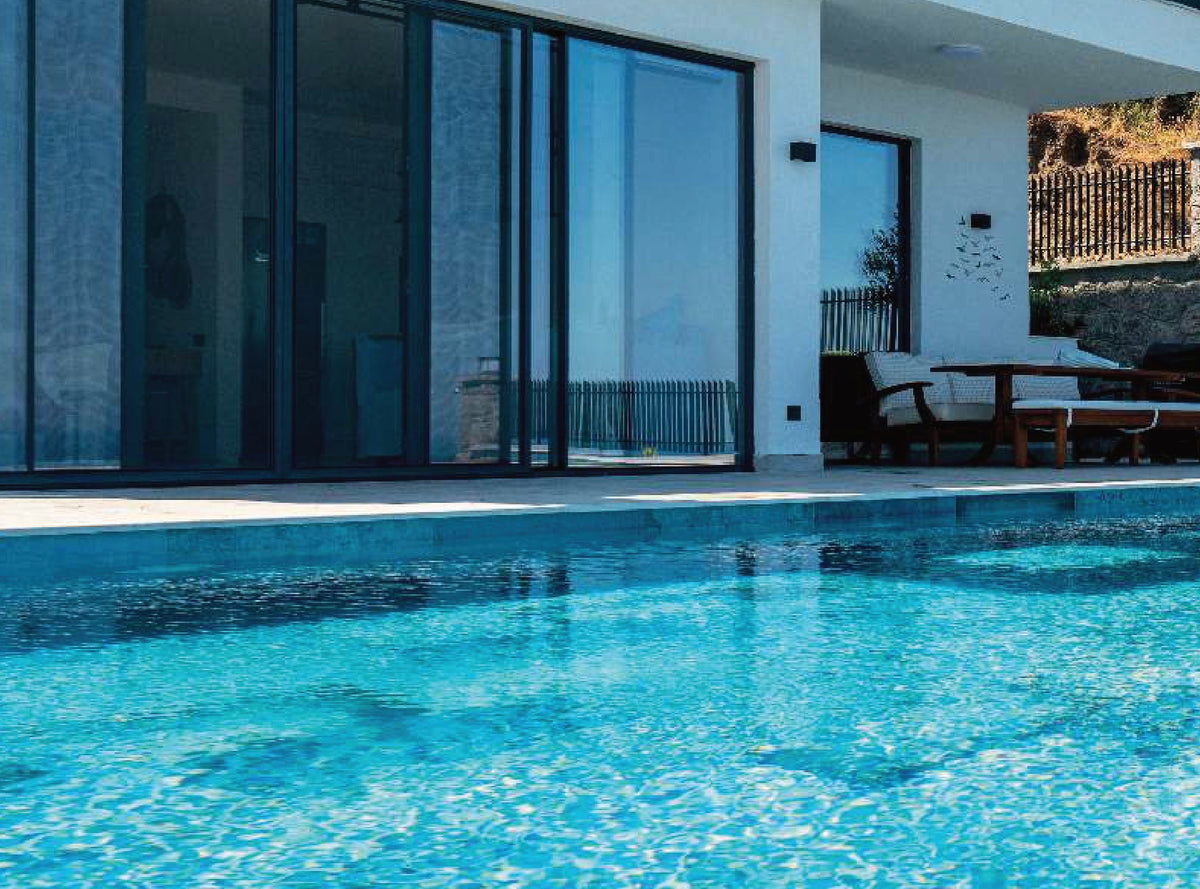 SeraPool Natural Blue Bead porcelain pool tile installed in a finished pool project