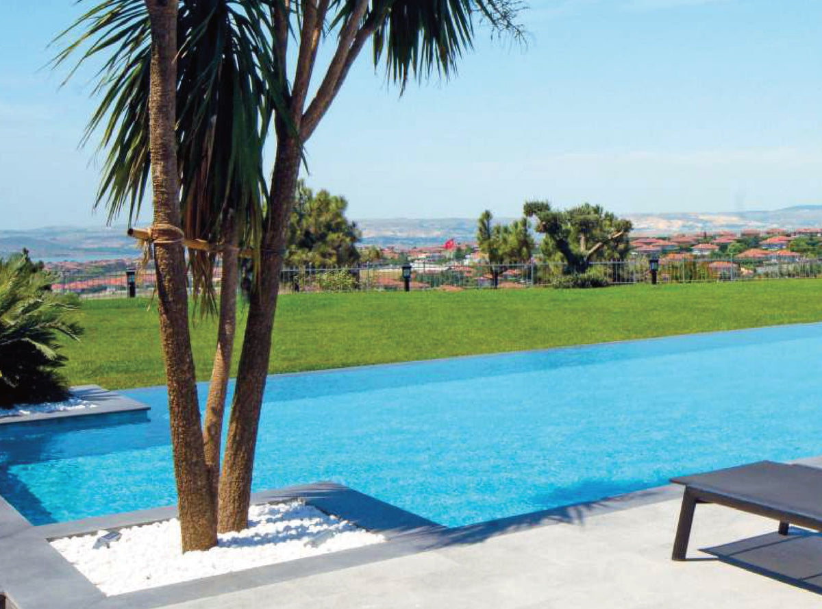 SeraPool Natural Oceano porcelain pool tile installed in a finished pool project