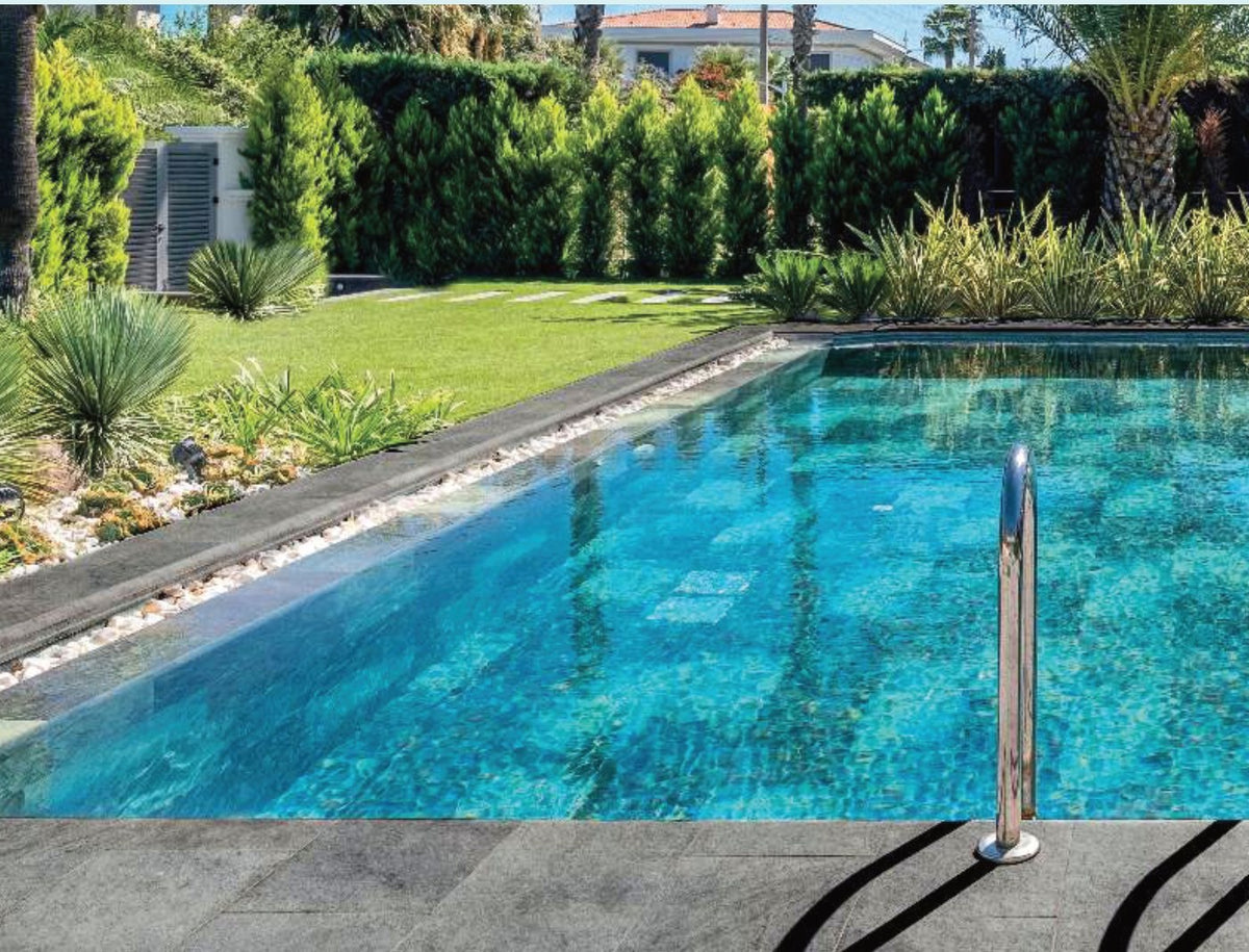 Pool Garden Anthracite porcelain pool deck tile around a residential pool, project example