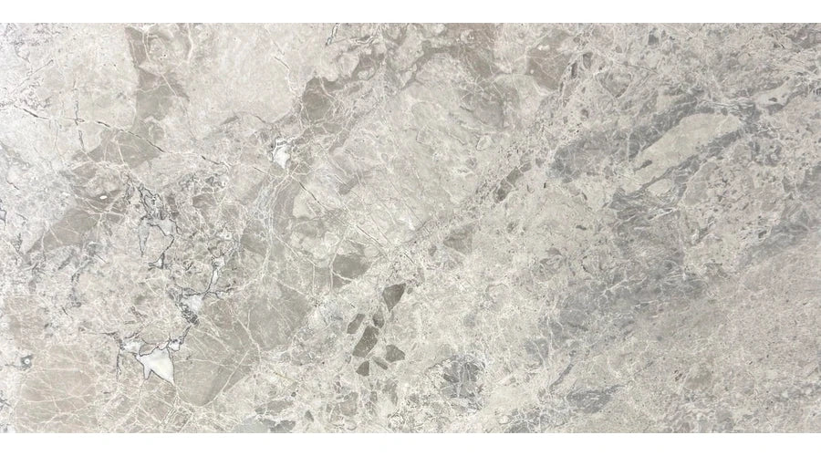Tundra Gray Marble Tile showing 12×24 polished honed format and natural cool gray with fine white and charcoal movement.