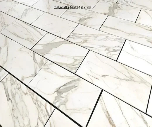 Elevate Your Space with Luxurious White and Gold Tiles: Calacatta Gold Marble