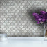 A Kitchen Backsplash with Midnight Umber pressed glass hexagon mosaic tile in a matte finish.