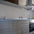 Slate Stone 3x6 subway tile adding depth to a sleek kitchen backsplash.