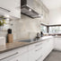 A modern Kitchen designed with Urban Edge Warm Patina Porcelain Tile