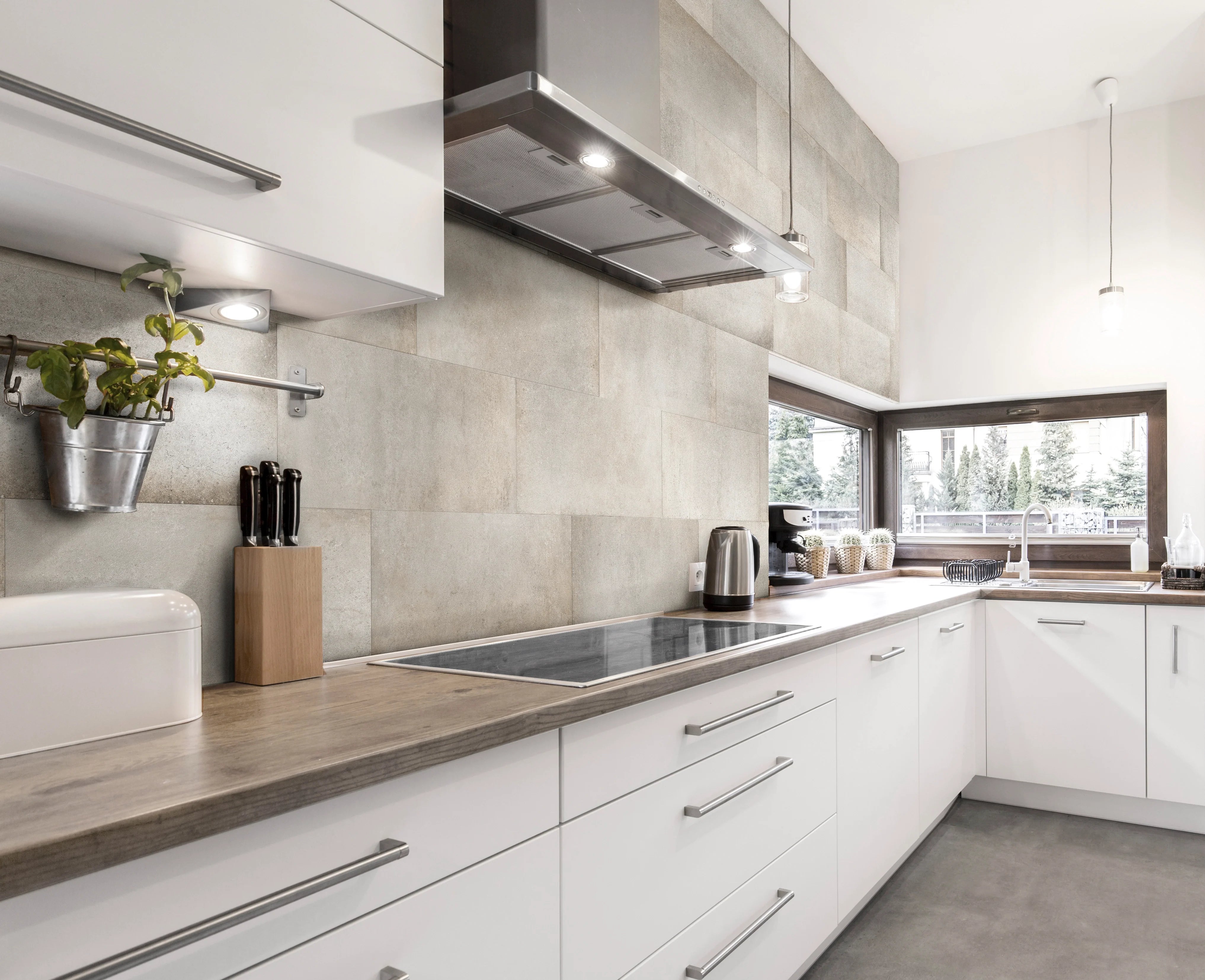 A modern Kitchen designed with Urban Edge Warm Patina Porcelain Tile