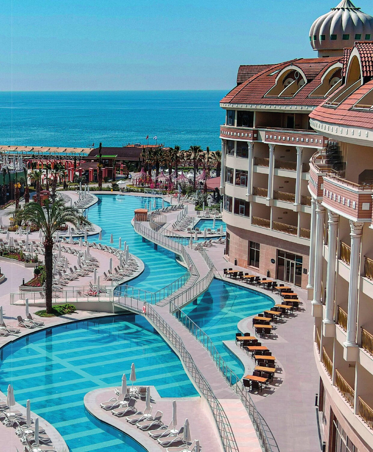 Resort lagoon pool with SeraPool Natural porcelain pool tile and porcelain pool deck, Antalya, Türkiye