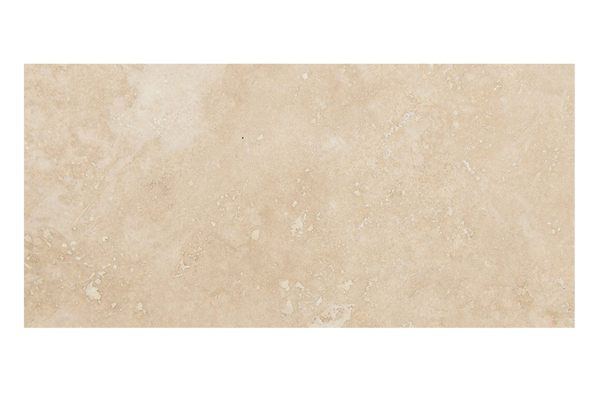 Ivory Travertine 12×24 cross-cut tiles in a honed and filled finish, warm ivory-beige natural stone.