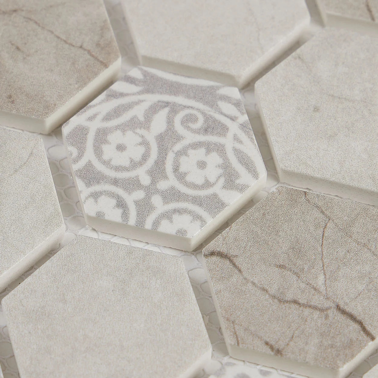 Ash Mirage hexagon mosaic tiles used as a kitchen backsplash. Detailed motive close-up image.