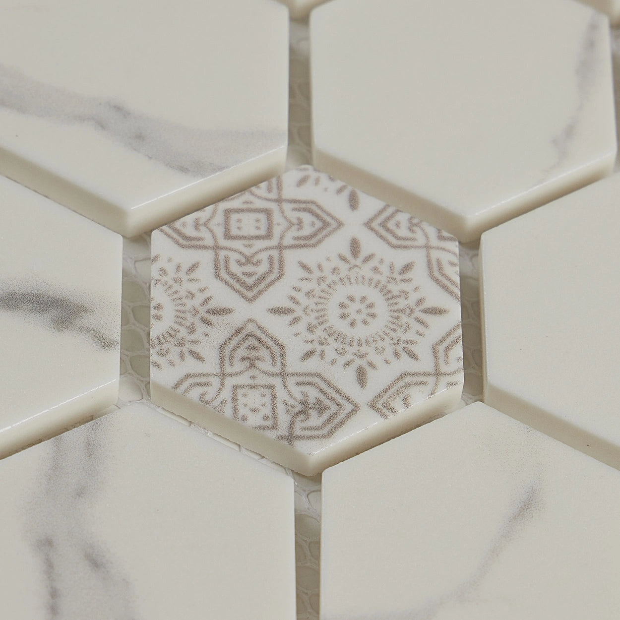 Arctic Veil hexagon mosaic tile from the Crafted Elegance Collection. Close-up image showing motive detail.