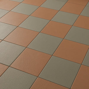 Angled close-up of Terracotta & Olive 7×7 matte porcelain checkerboard floor texture.