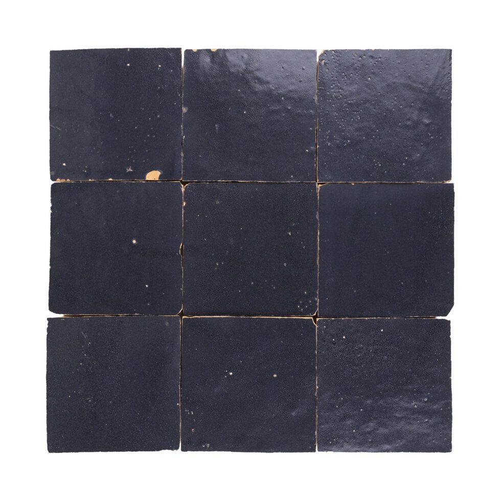 Nine navy blue 4x4 square zellige tiles arranged in a 3x3 grid on a white background
