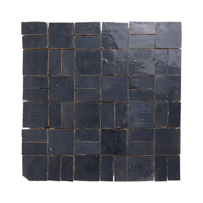 Zellige mosaic pattern of dark blue tiles on a white background