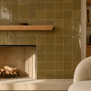 Aveline Amber Clay 4×4 semi-gloss ceramic mosaic installed on a contemporary fireplace wall