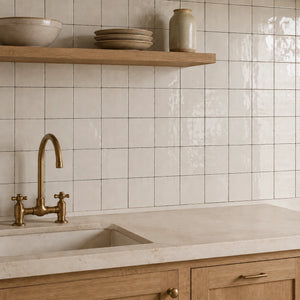 Aveline Chalk White 4×4 semi-gloss ceramic mosaic installed as a kitchen backsplash