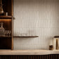 Aveline Chalk White semi-gloss trapezoid ceramic mosaic installed on a luxury bar feature wall